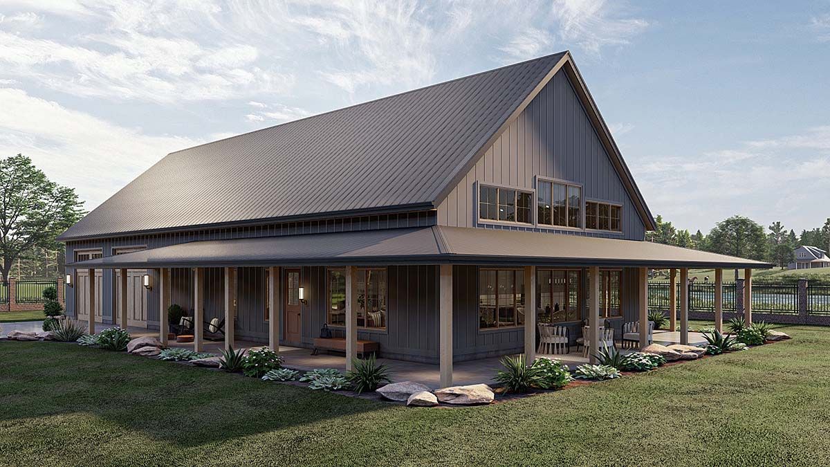 Modern barn-style house with a steep metal roof, wraparound porch, and large windows in a grassy yard