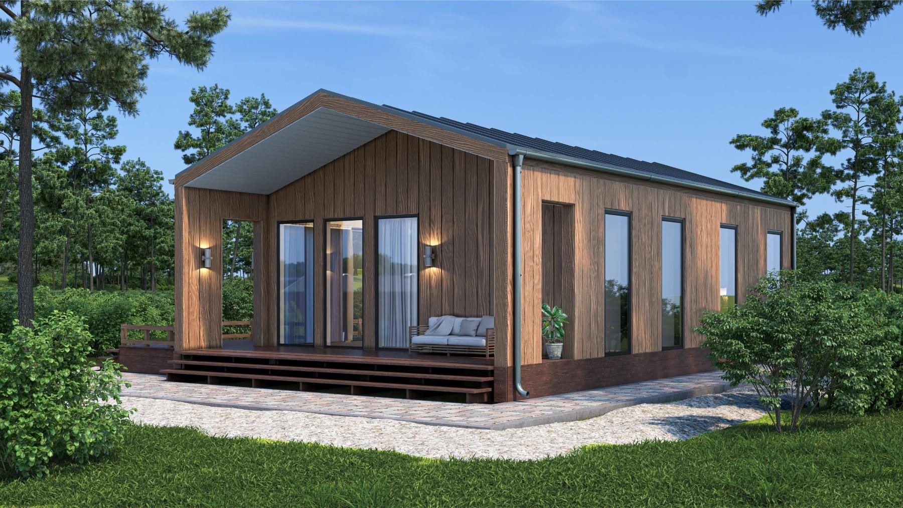 Modern wooden cabin with porch and large windows in a wooded setting