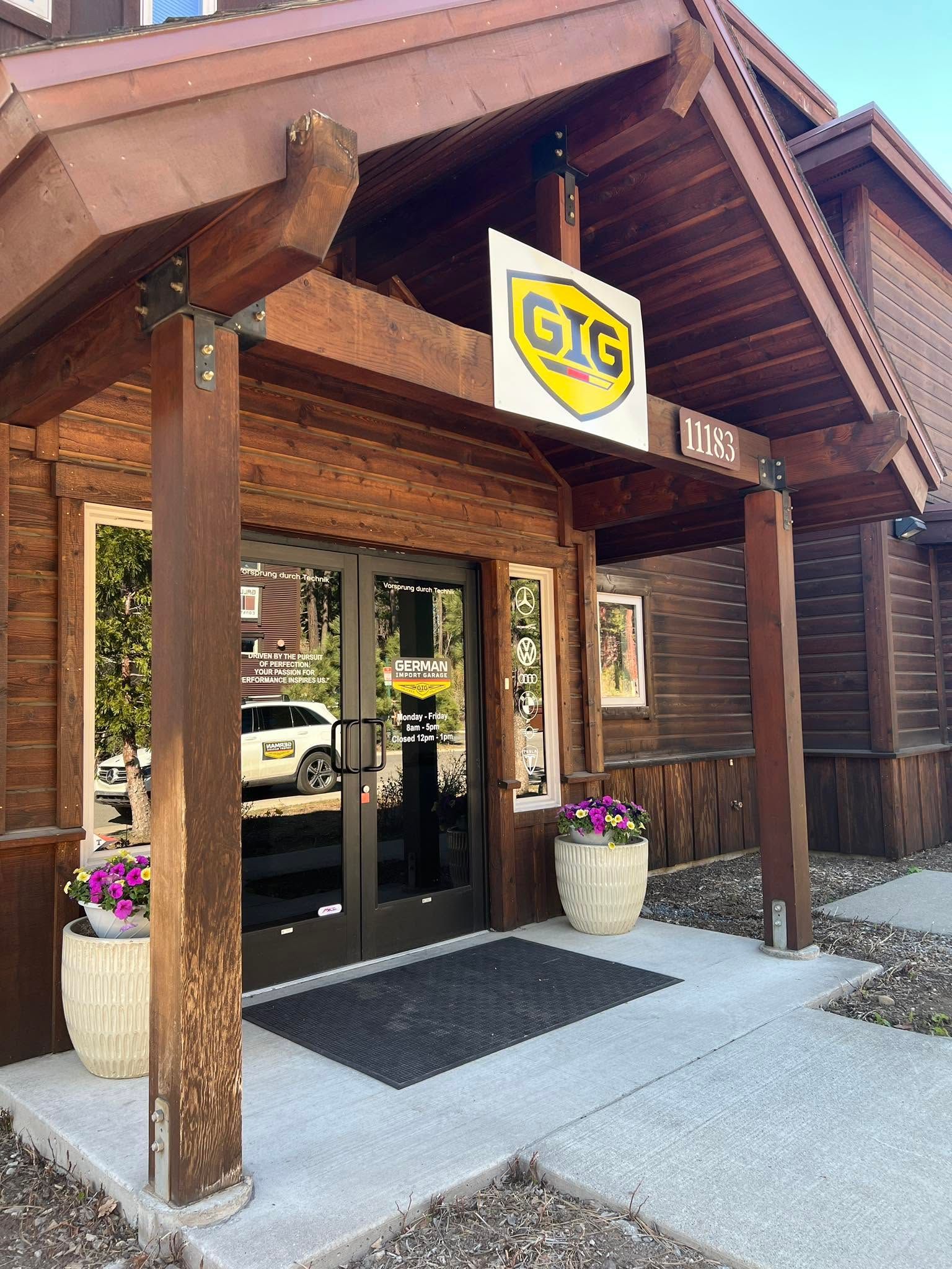 Wooden Auto Repair Shop Entrance With Glass Doors | German Import Garage