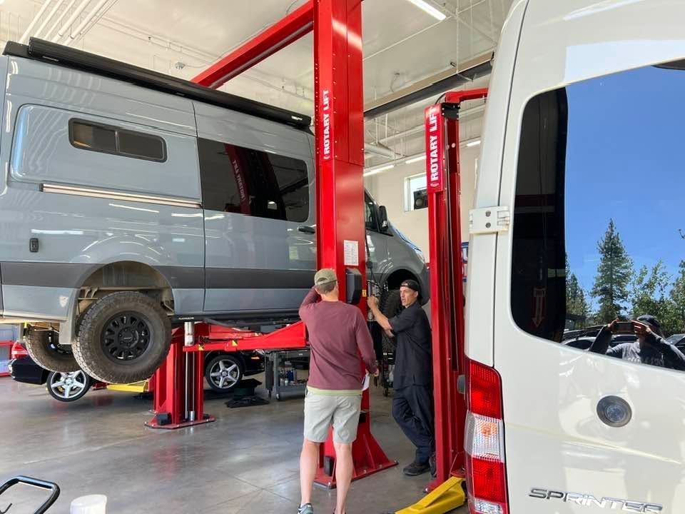 Sprinter Vans And Two People Inside The Service Bay | German Import Garage