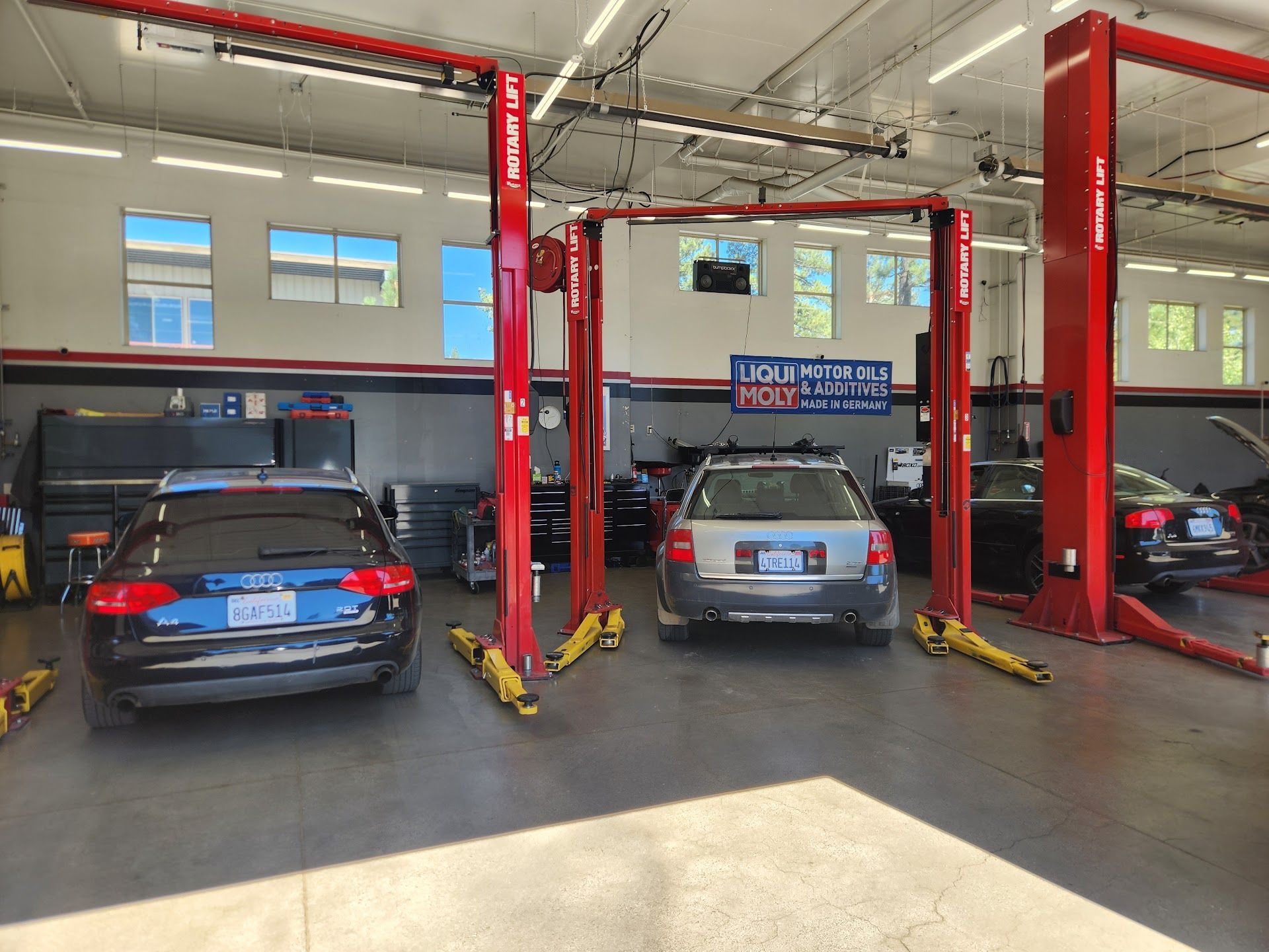 European Vehicles In Service Bays With Automotive Lifts | German Import Garage