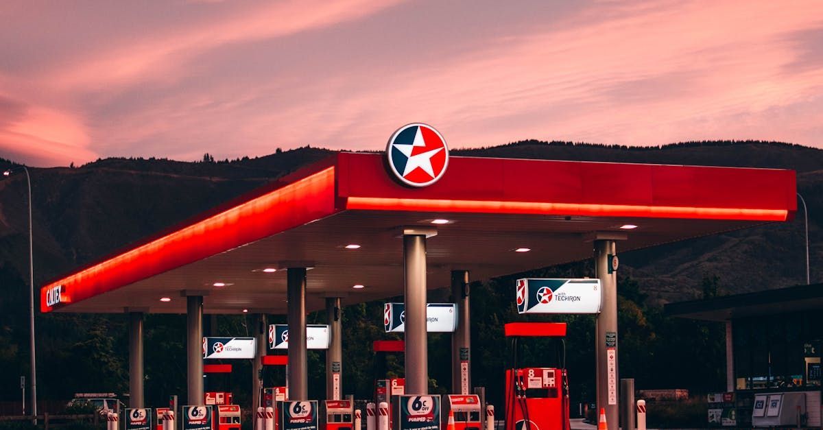 A gas station with a red roof and a white star on it.