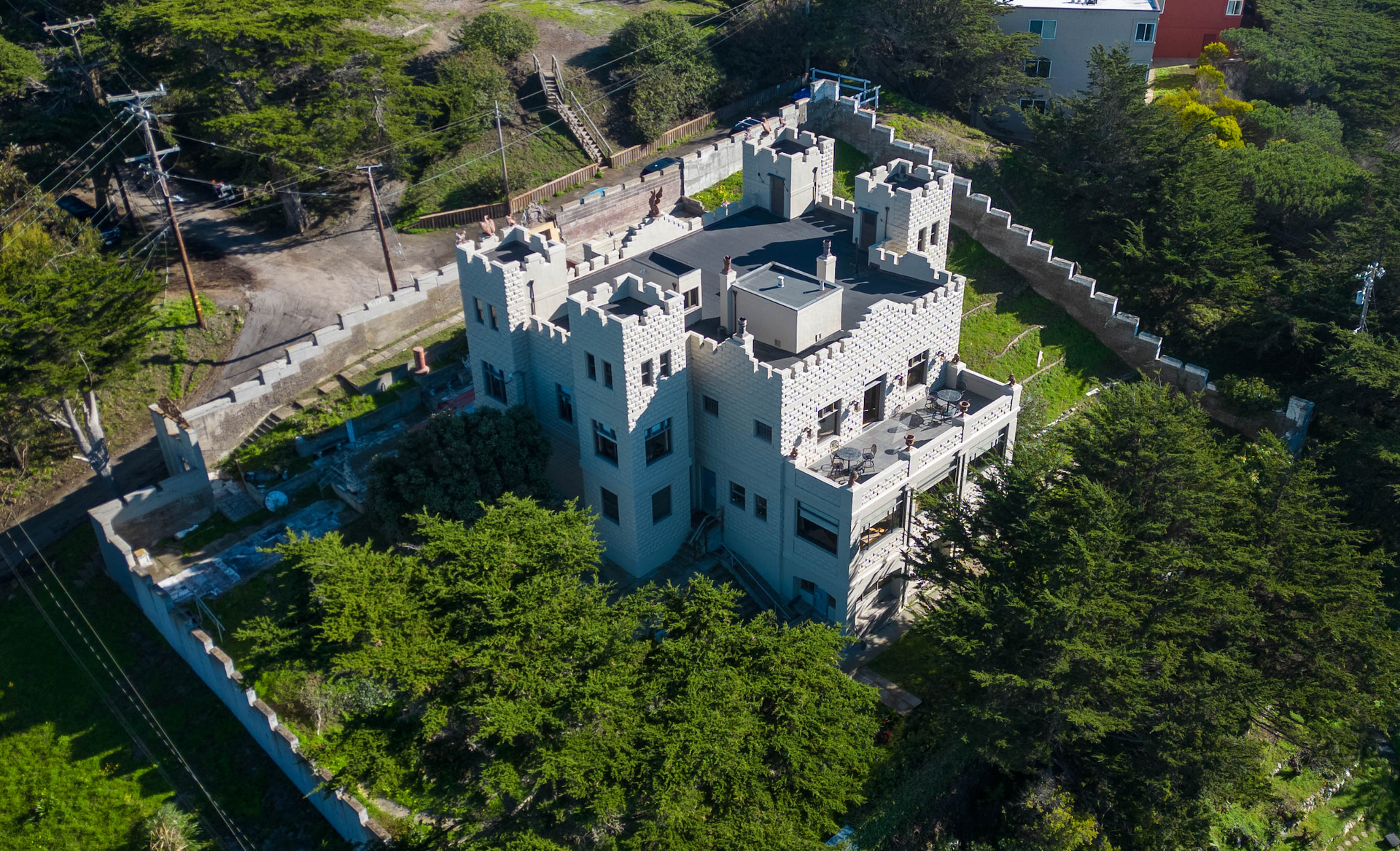An aerial view of a castle surrounded by trees
