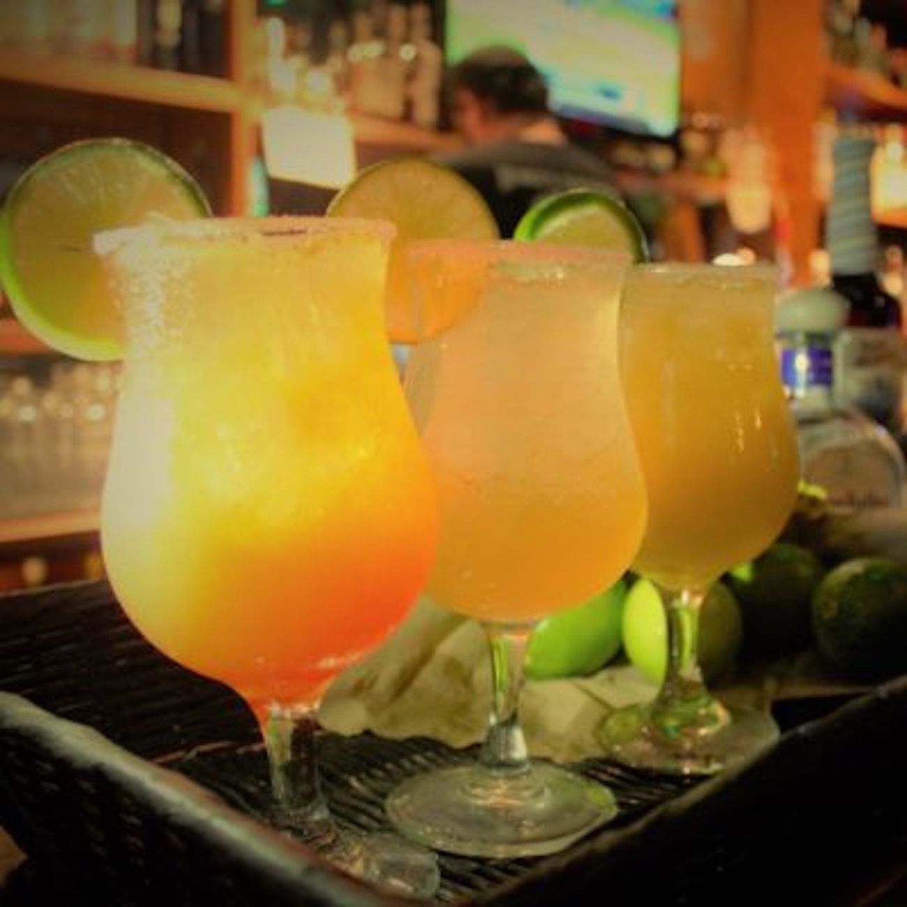 A tray of drinks with lemon slices on them