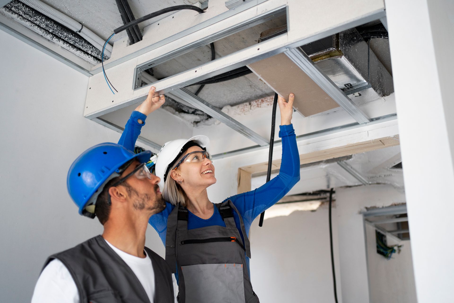 residential air duct cleaning services with a air duct cleaning team cleaning a vent system