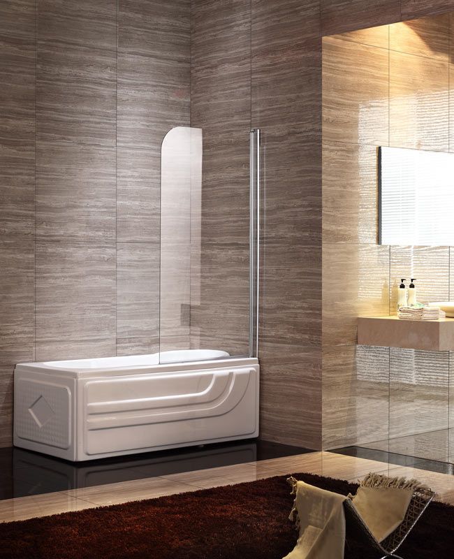 A modern white bathtub with a clear glass screen installed against wood-textured tiled walls in a bathroom.