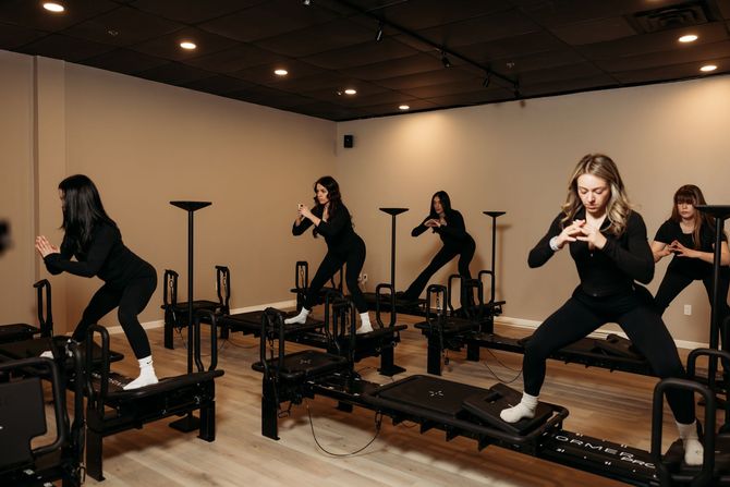Clients taking a Lagree class at Micro Moves fitness studio