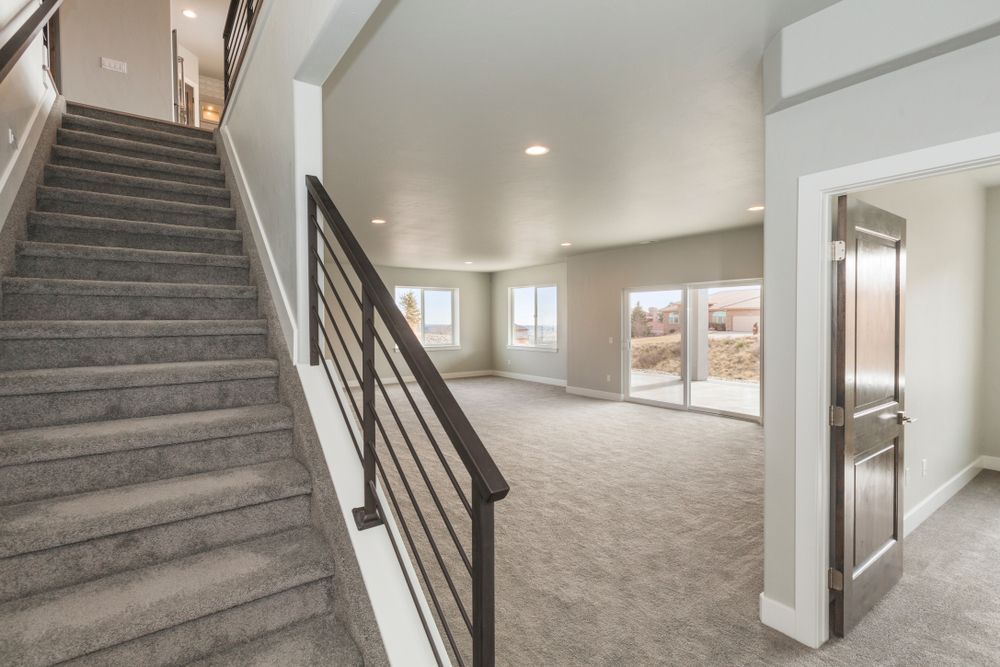 there are stairs leading up to the second floor of a house .
