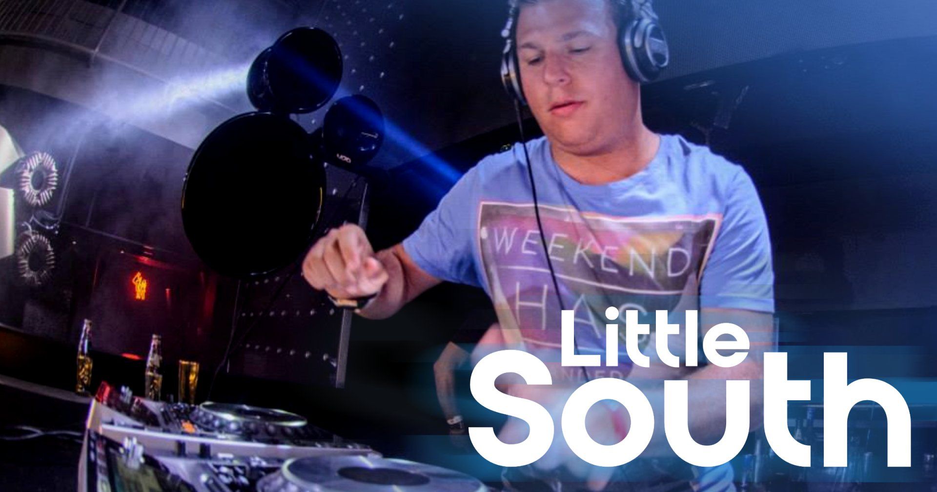 A man wearing headphones is playing music on a turntable.