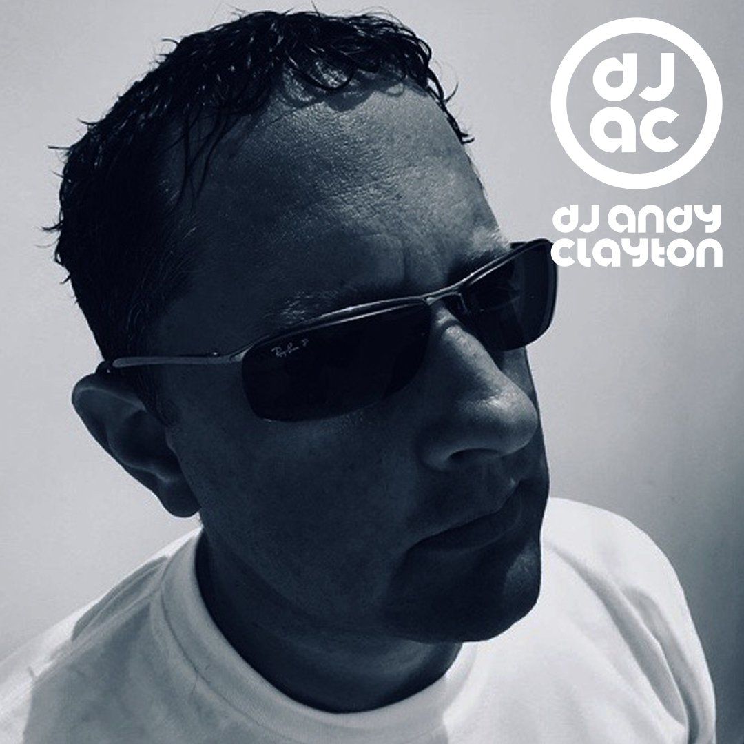 A man wearing sunglasses has the name dj andy clayton on his shirt
