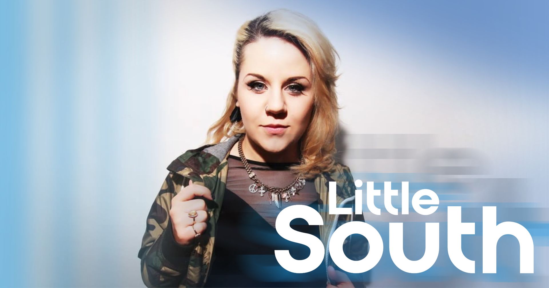 A woman is standing in front of a blue background with the words little south on it.