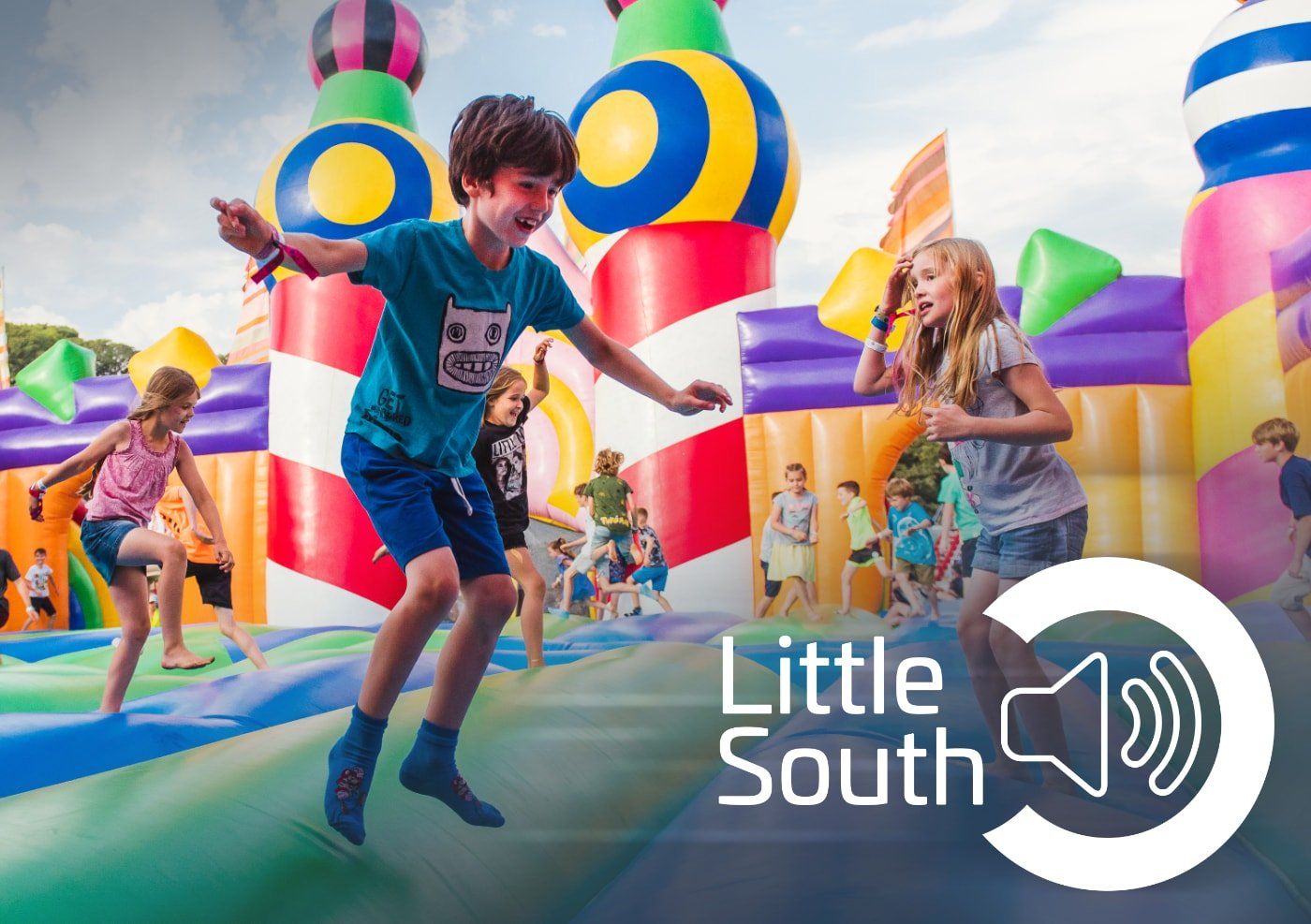 A group of children are jumping in a bouncy house.