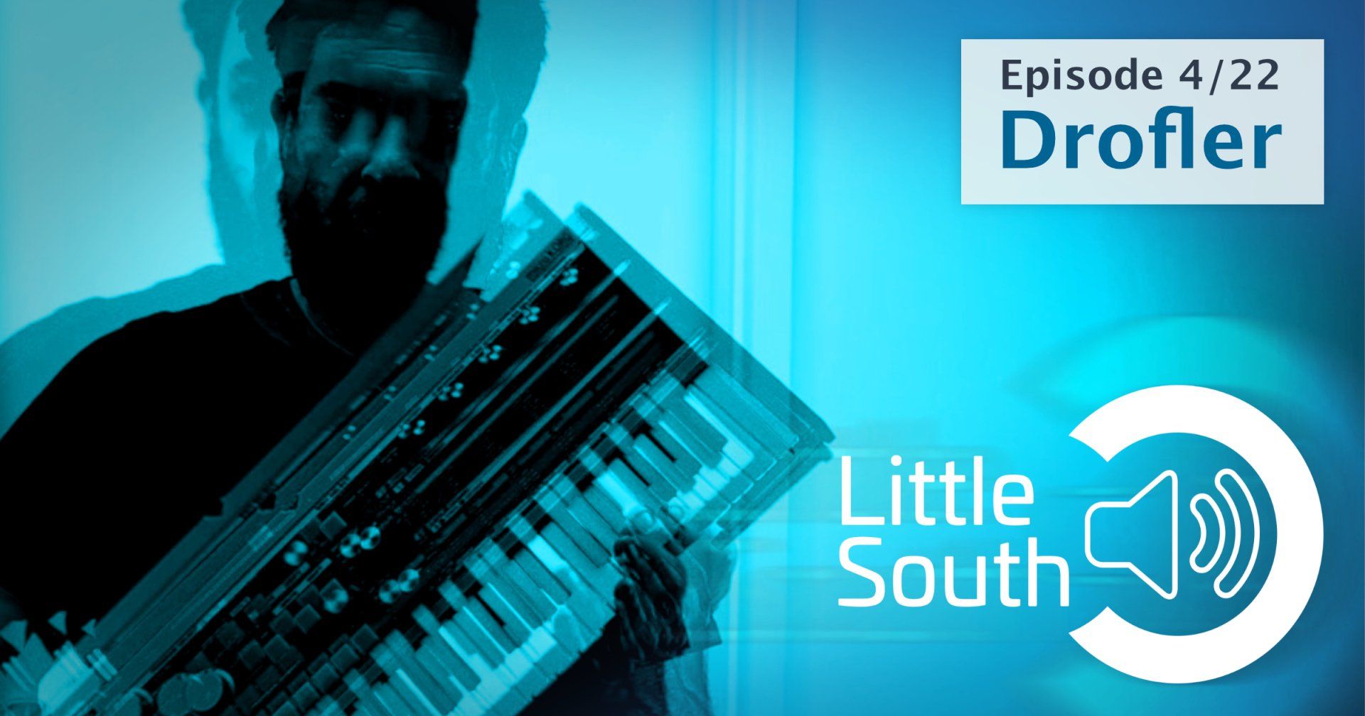 A man is holding a keyboard in front of a blue background that says little south