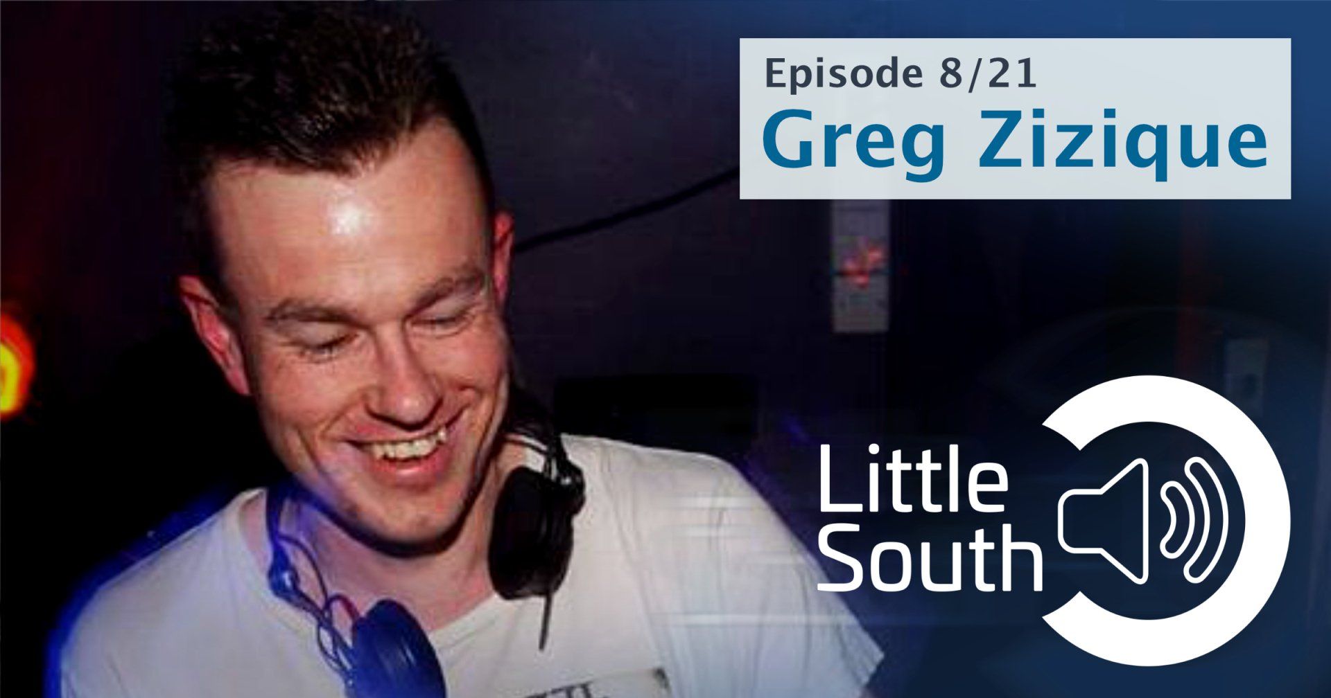 A man wearing headphones is smiling in front of a little south logo