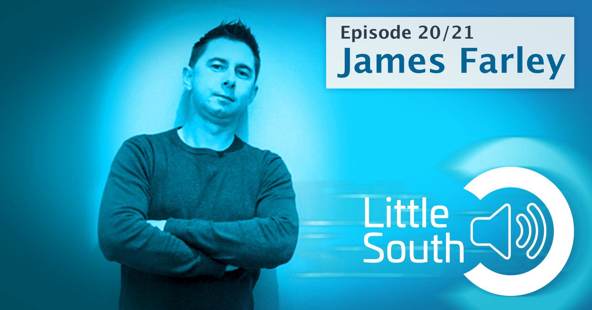 A man is standing with his arms crossed in front of a little south logo