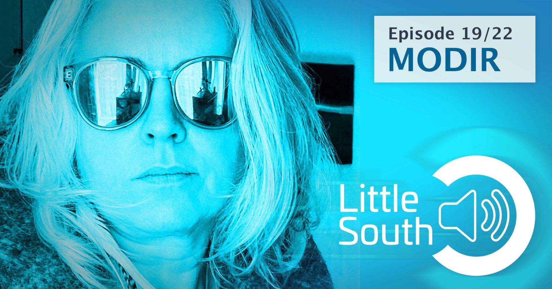 A woman wearing sunglasses and a little south logo