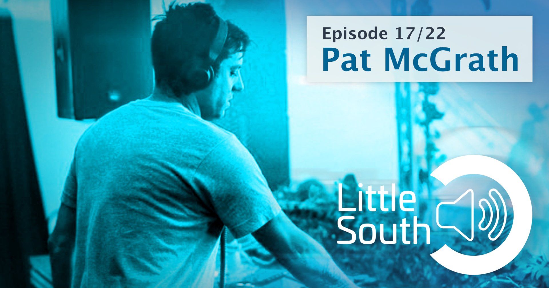 A man wearing headphones and a little south logo