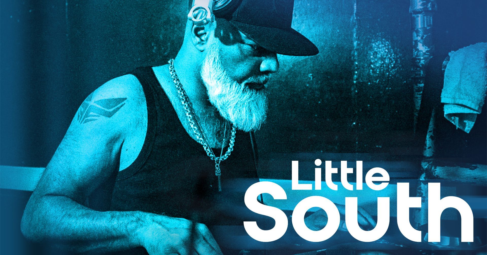 A man with a beard is on a little south poster