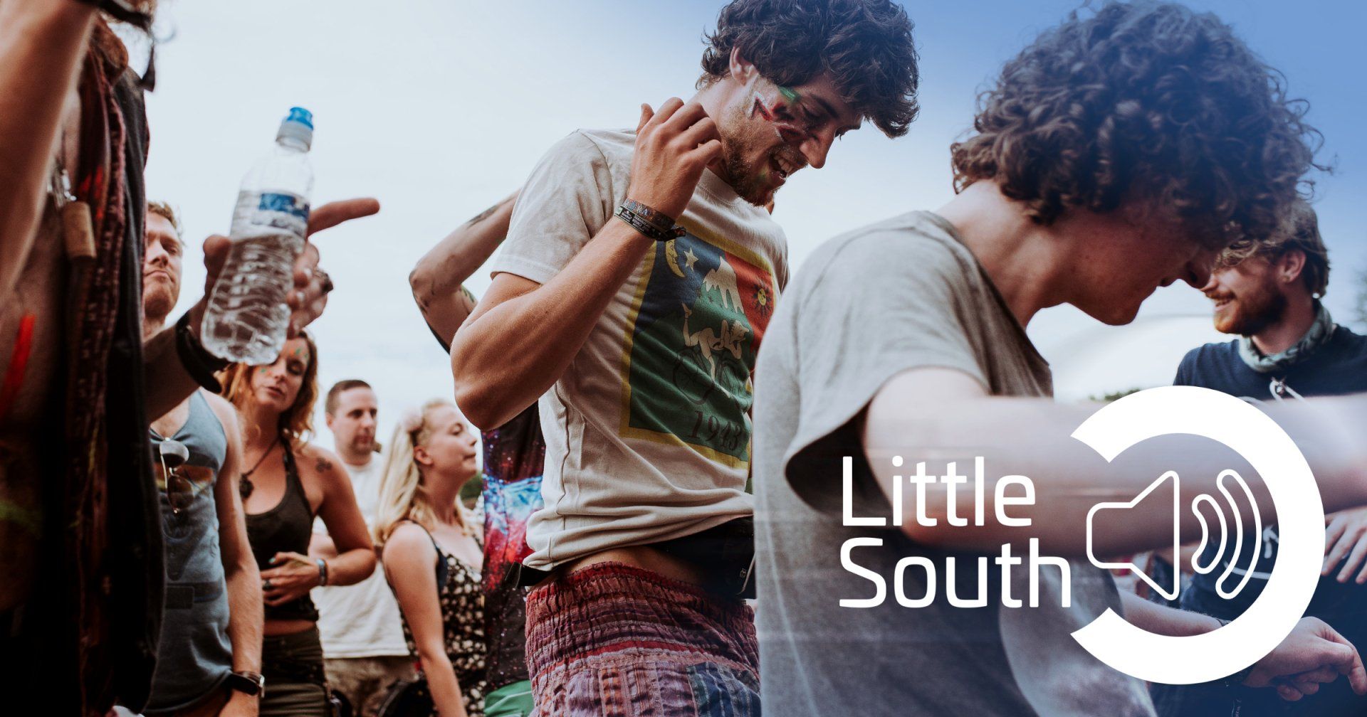 A group of people are dancing at a little south festival