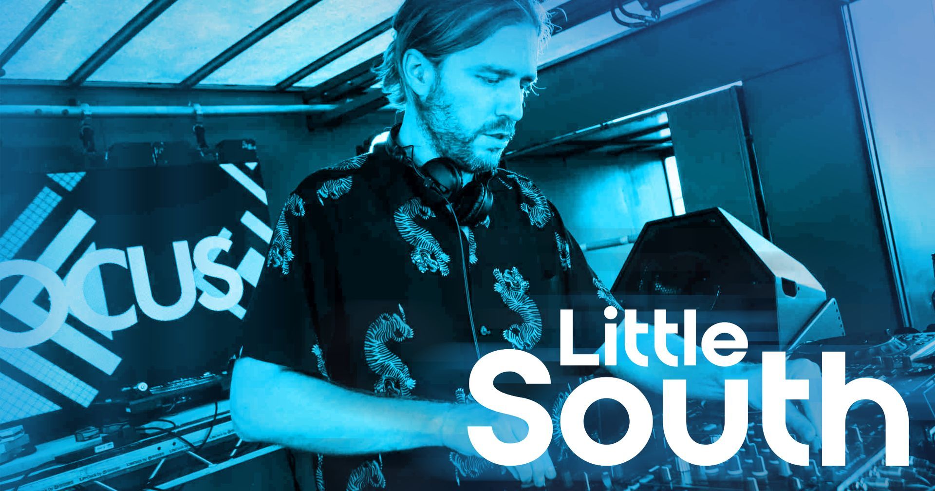A man is playing a dj set with the words little south on the bottom