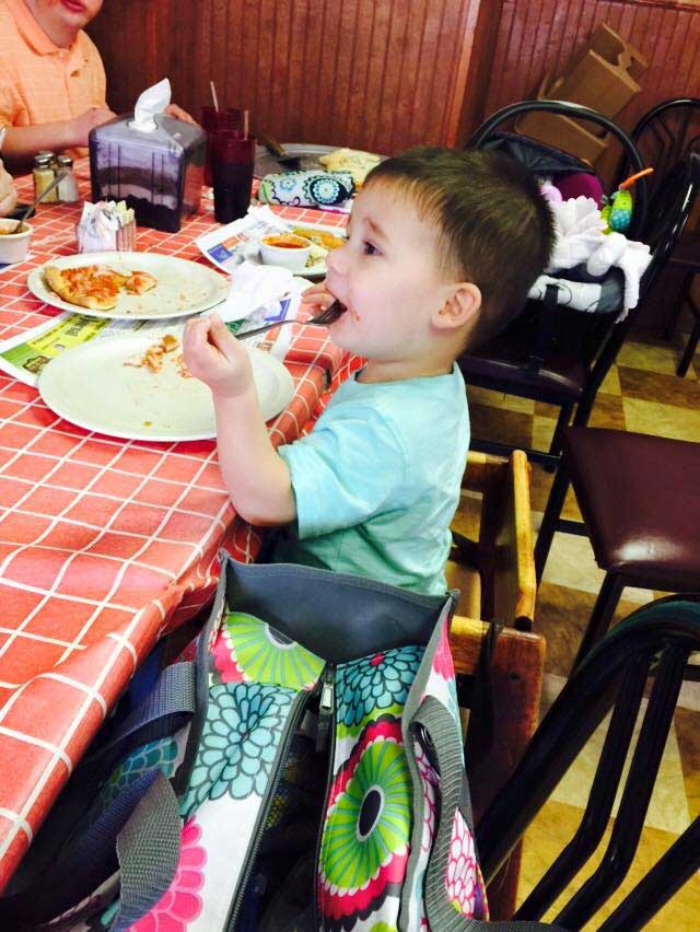 Kid enjoying food — Mifflinburg, Pa — The Original Italian Pizza & Restaurant