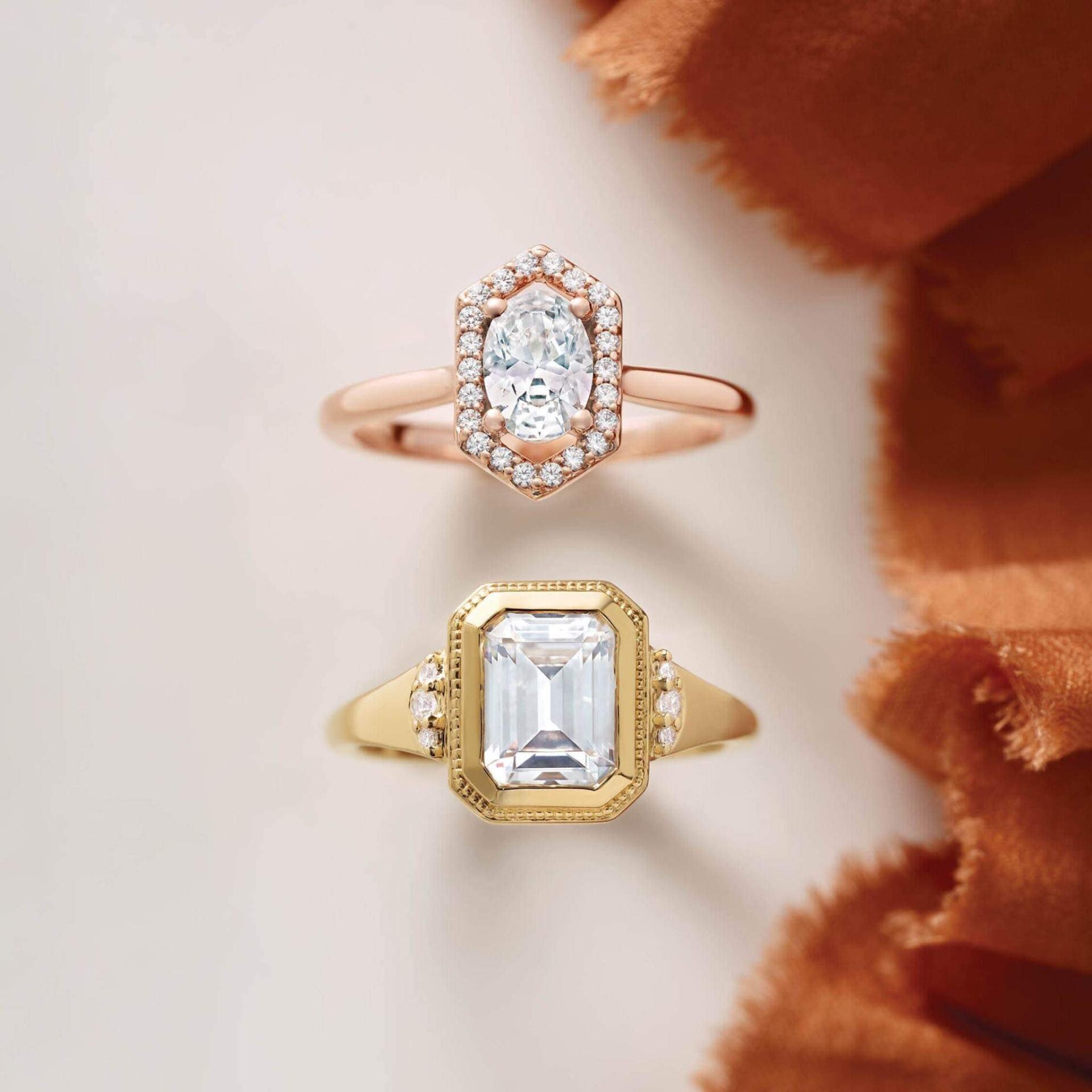 Two rings are sitting next to each other on a table.