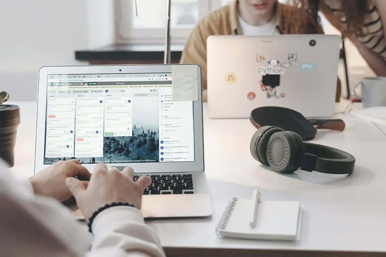 People collaborating in a bright, modern workspace, reflecting the intentionality of choosing meaningful people and boundaries over performing for crowds.