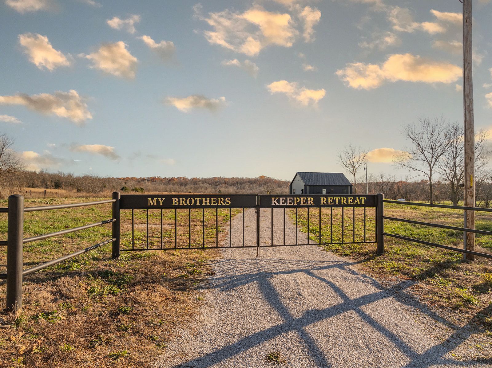 A gate with the words `` my brothers keeper retreat '' on it