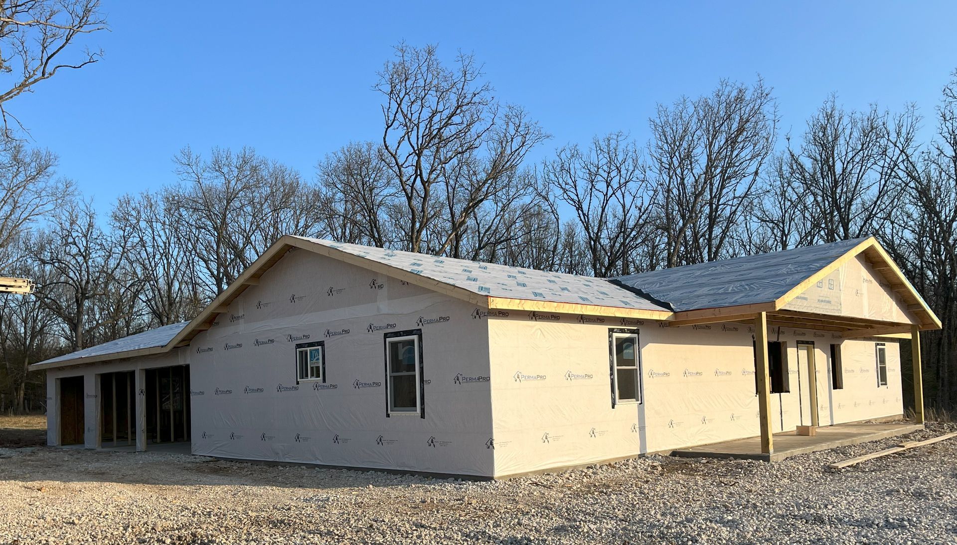 A house that is being built with a blue sky in the background