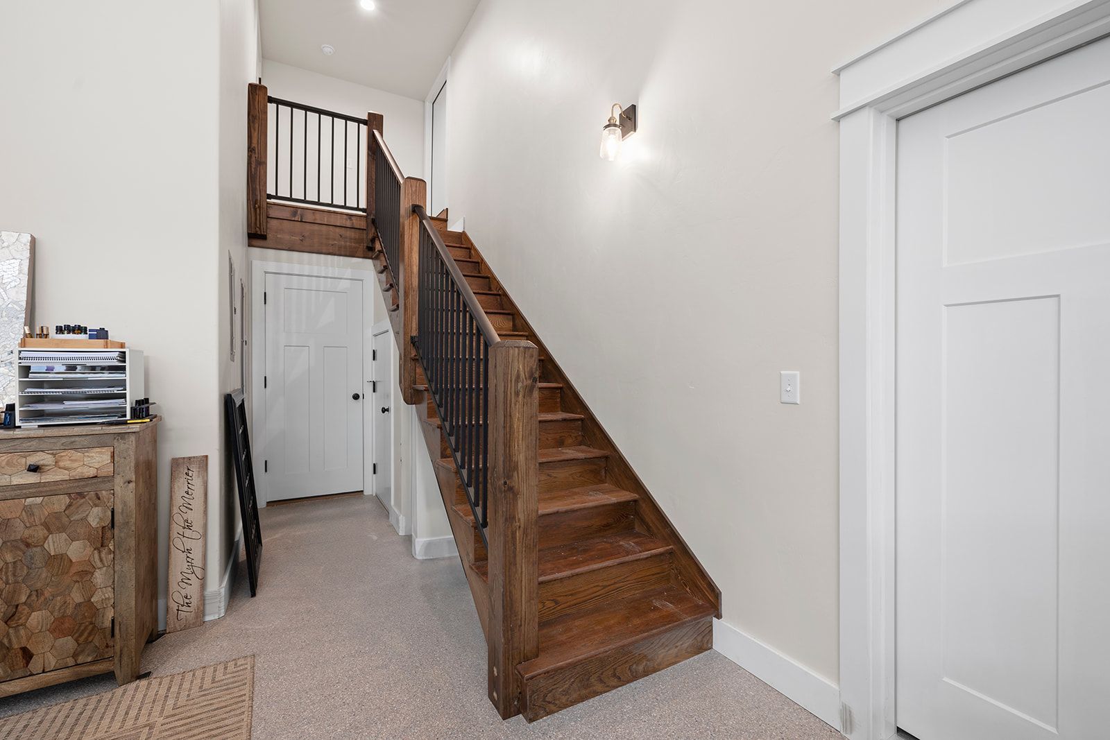 A wooden staircase leading up to the second floor of a house.