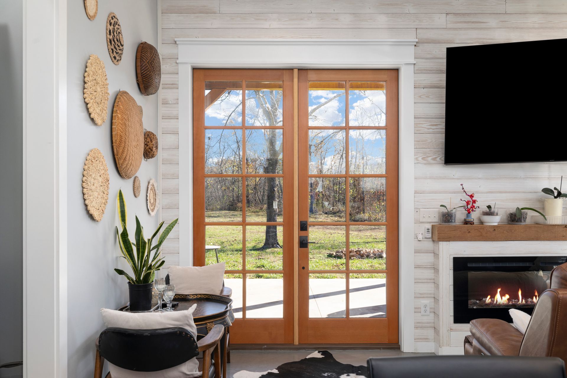 A living room with a fireplace and a flat screen tv.