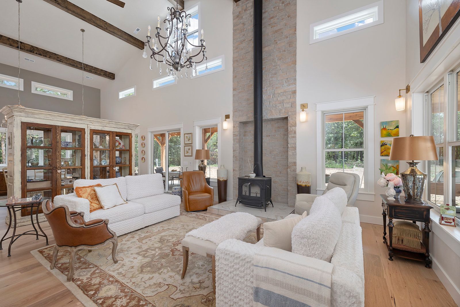 A living room filled with furniture and a fireplace.