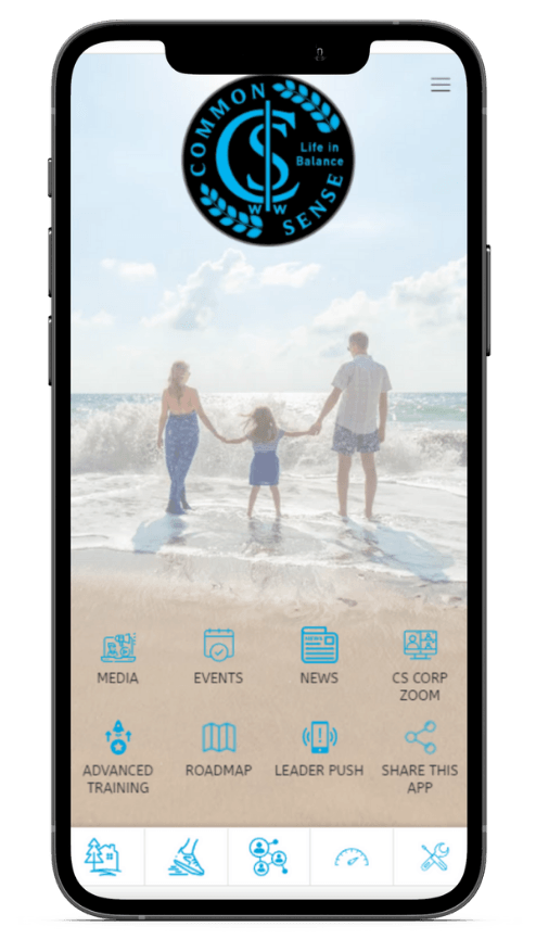 A cell phone with a picture of a family holding hands on the beach.