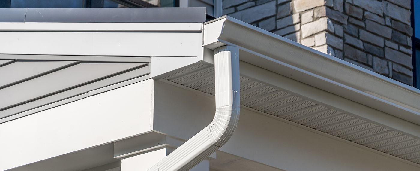 White house with white gutter and downspout.