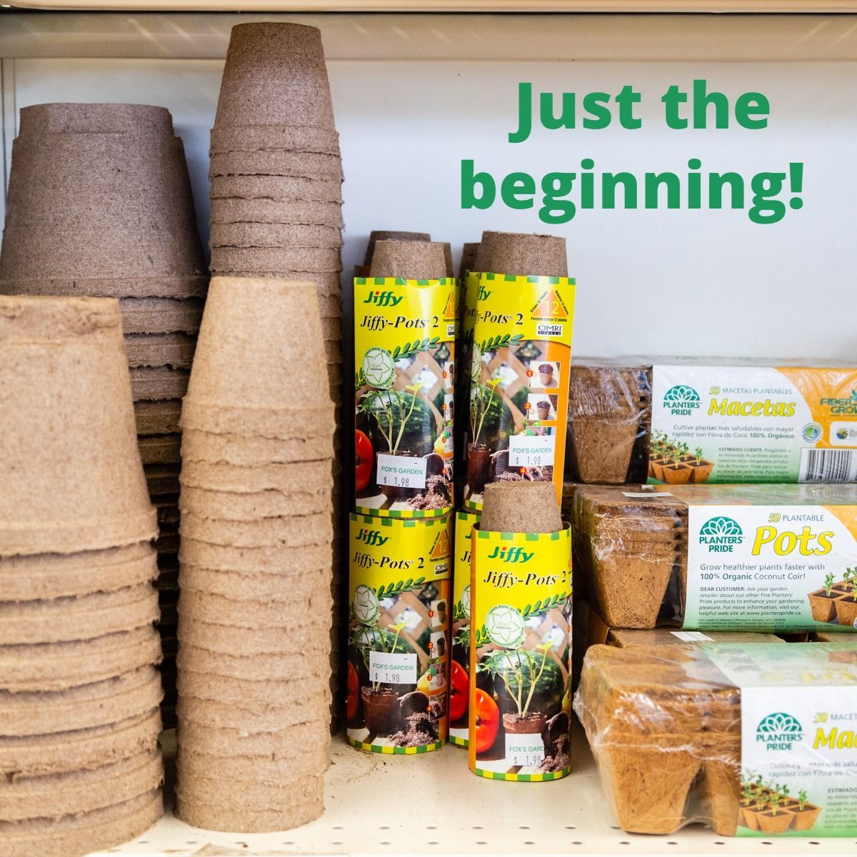 Pots and seed starting supplies on a store shelf, text