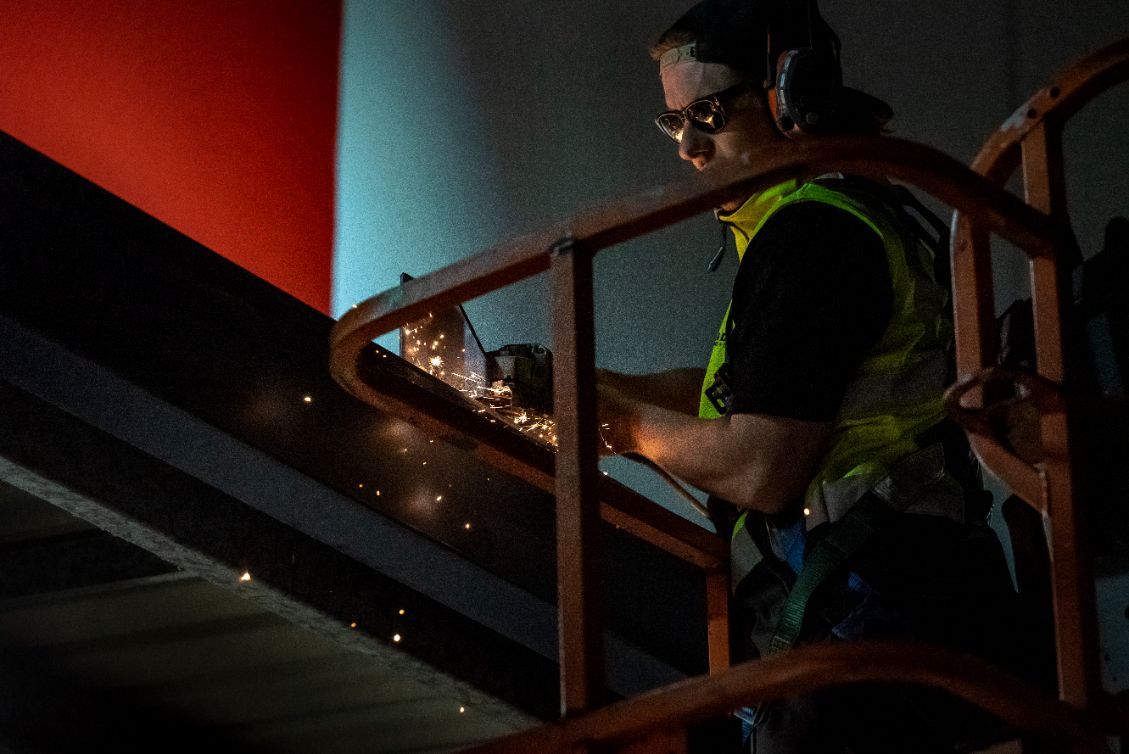Man Cutting Metal Bars — Demolition Services In Southeast Queensland