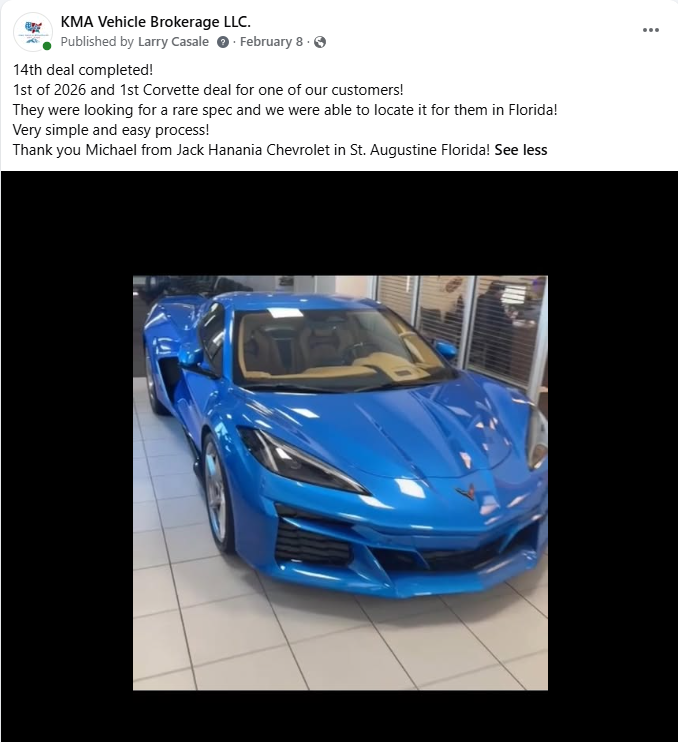 Blue sports car displayed indoors on a tiled showroom floor