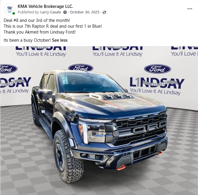 Black Ford pickup displayed in a dealership showroom with Lindsay branding backdrop