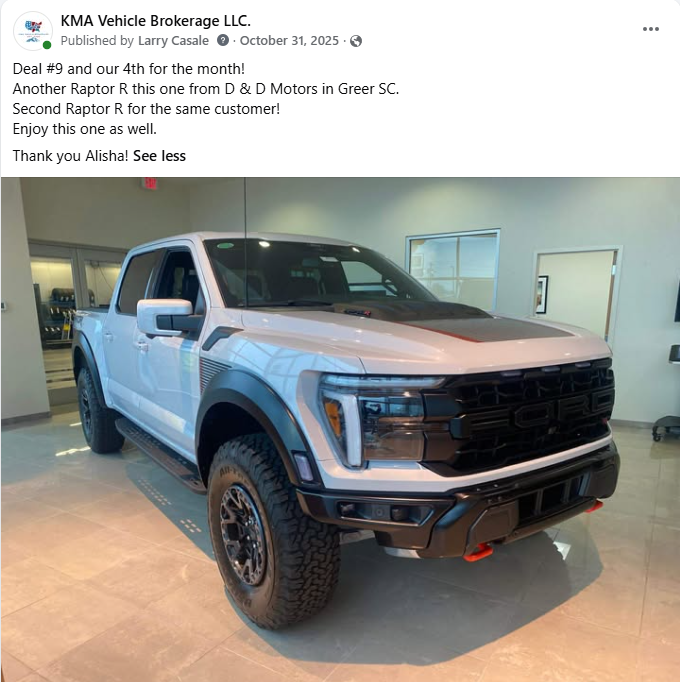 Light blue lifted pickup truck displayed in a dealership showroom.