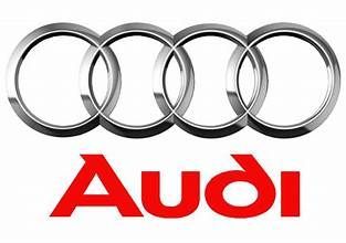 Audi logo with four silver rings above red “Audi” text on a white background