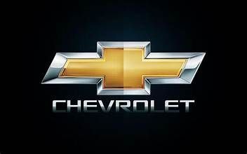 Chevrolet gold bowtie logo with silver edges on a black background