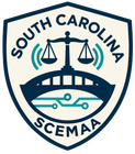 South Carolina SCEMAA shield logo with scales, bridge, and circuit lines in blue and teal