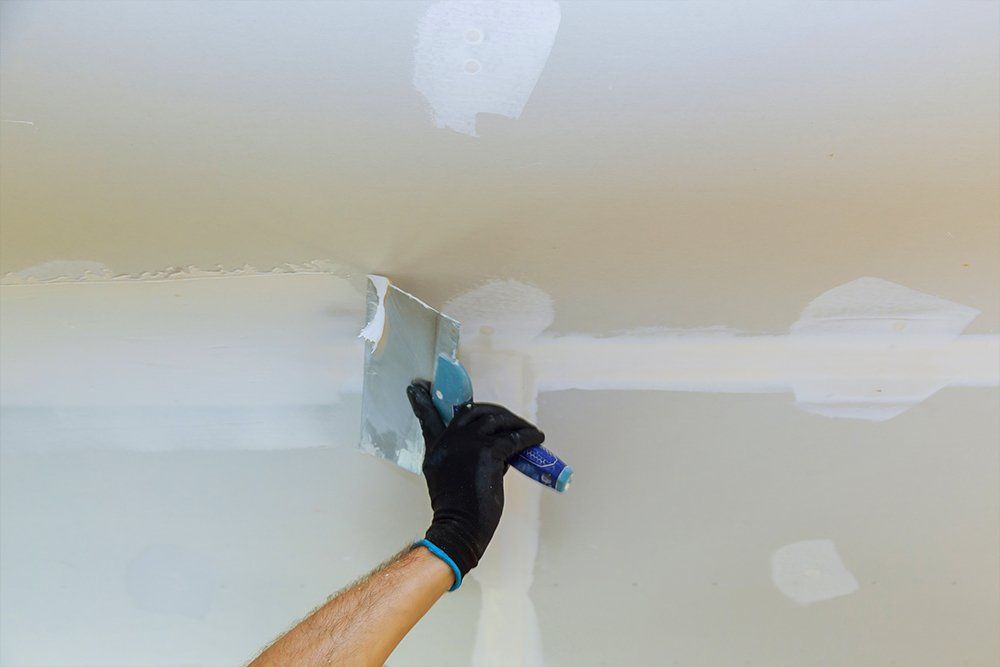 Worker Puttied Wall Paint — Merrillville, IN — Van Gogh Inc.