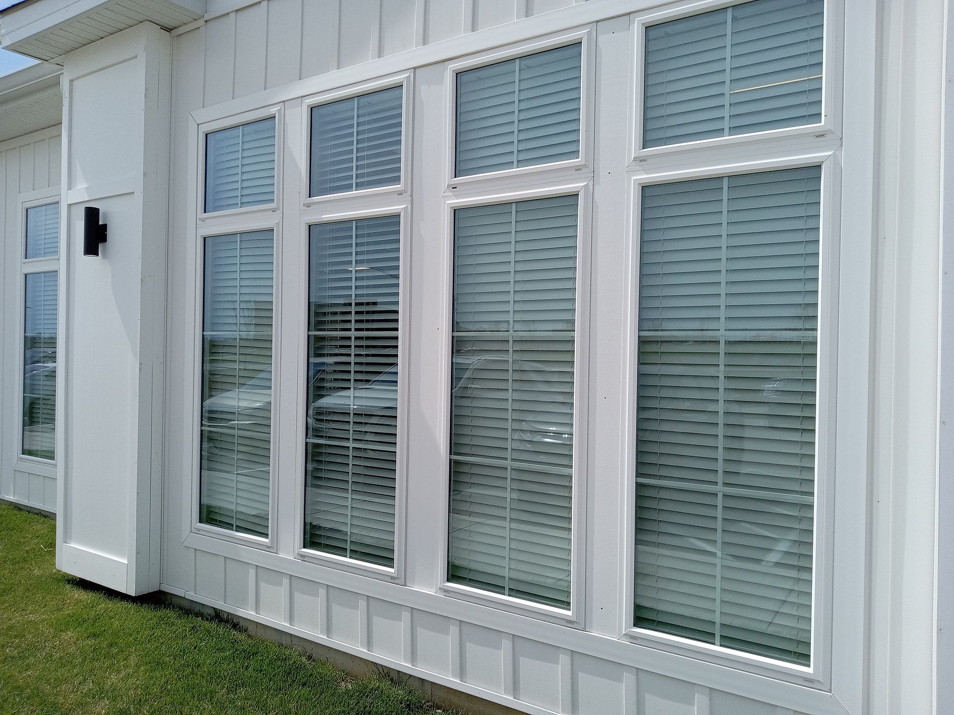 New vinyl windows installed during residential home improvement project. New vinyl windows installed during residential home improvement project.