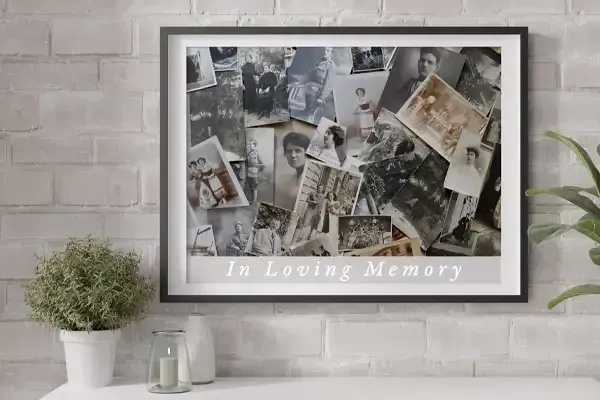 Framed “In Loving Memory” collage on a white brick wall above a shelf with a plant and candles