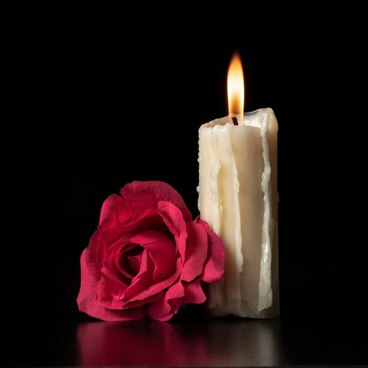 Candle with red rose