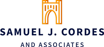 The logo for samuel j. cordes and associates has a castle on it.