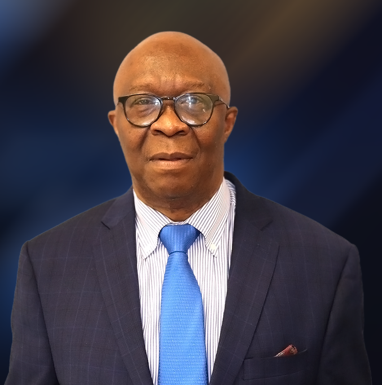 A bald man wearing glasses and a suit and tie