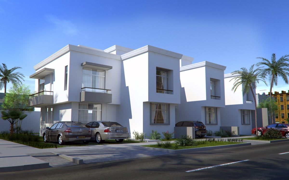 Moderna casa blanca de dos plantas con coches aparcados delante y palmeras a lo largo de la calle.