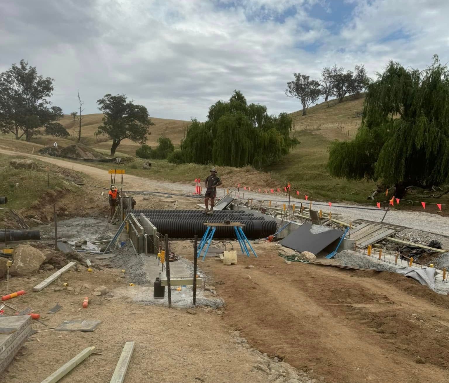 A Group of Construction Workers Are Working on a Concrete Floor — Next Level Construction Contractors in Gundagai, NSW